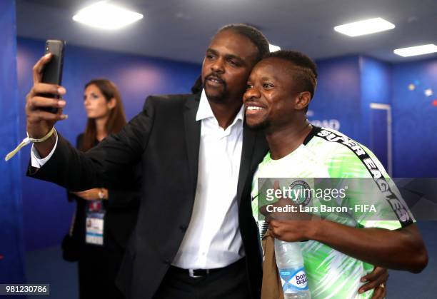 Former player of Nigeria Nwanko Kanu poses for a selfie with Ogenyi Onaz prior to the 2018 FIFA World Cup Russia group D match between Nigeria and...
