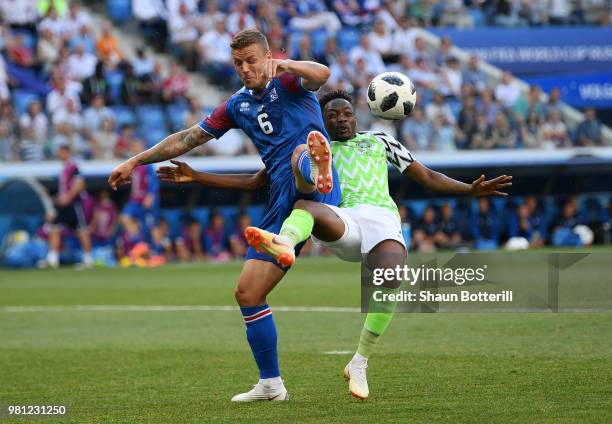 Ragnar Sigurdsson of Iceland tackles Ahmed Musa of Nigeria during the 2018 FIFA World Cup Russia group D match between Nigeria and Iceland at...