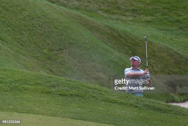 Steve Wheatcroft watches his second shot on the 18th hole during the second round of the Travelers Championship at TPC River Highlands on June 22,...