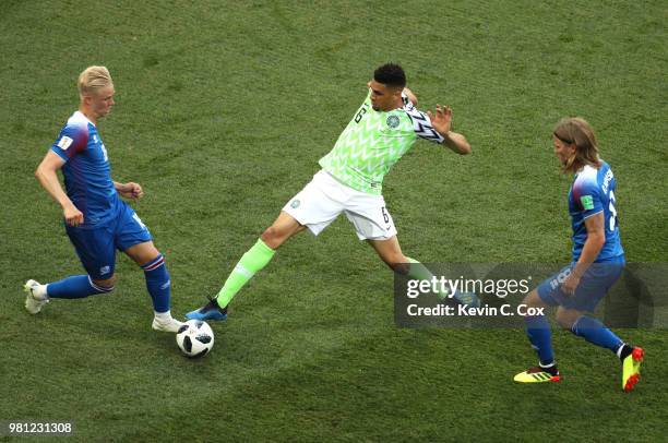 Leon Balogun of Nigeria tackles Hordur Magnusson of Iceland during the 2018 FIFA World Cup Russia group D match between Nigeria and Iceland at...