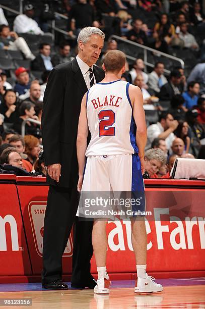 Head coach Kim Hughes talks with Steve Blake of the Los Angeles Clippers during the game against the Atlanta Hawks at Staples Center on February 17,...