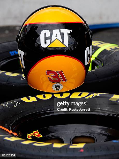 Helmet of a crew member for the Caterpillar Chevrolet sits on tires on pit road during the NASCAR Sprint Cup Series Goody's Fast Pain Relief 500 at...