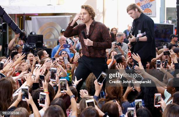 Luke Hemmings and Michael Clifford of 5 Seconds of Summer perform on NBC's "Today" at Rockefeller Plaza on June 22, 2018 in New York City.