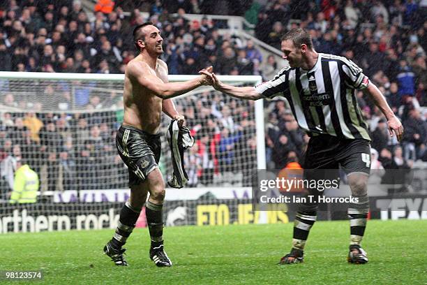 Kevin Nolan of Newcastle United congratulates Jose Enrique after scoring the second goal during the Coca Cola Championship match between Newcastle...