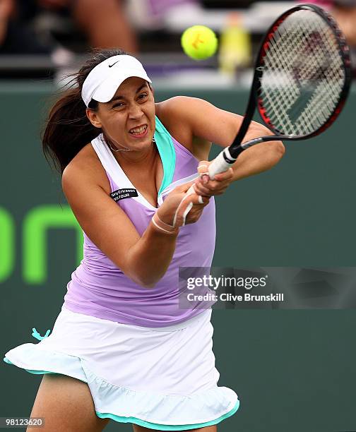 Marion Bartoli of France returns a shot against Svetlana Kuznetsova of Russia during day seven of the 2010 Sony Ericsson Open at Crandon Park Tennis...