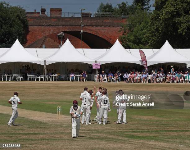 General view of play as Morne Morkel of Surrey celebrates with teammates after taking the wicket of Lewis Gregory of Somerset during day 3 of the...