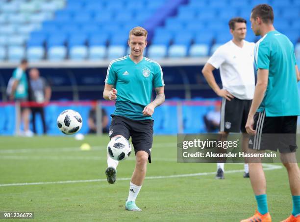 Marco Reus of Germany plays the ball with his team mate Julian Draxler during the Germany Training & Press Conference at Fisht Stadium on June 22,...