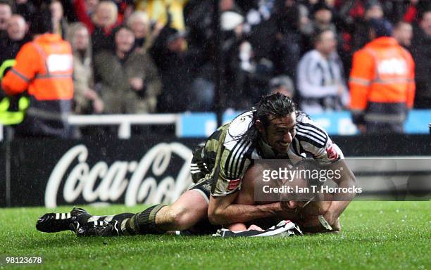 Jose Enrique of Newcastle United celebrates with Jonas Gutierrez after scoring the second goal during the Coca Cola Championship match between...
