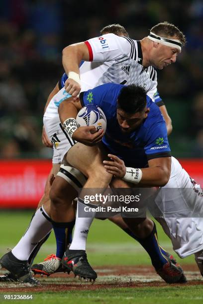 Henry Stowers of the Force gets tackled by Wyatt Crockett and Ethan Blackadder of the Crusaders during the World Series Rugby match between the...