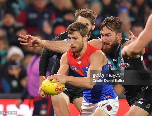 Jack Viney of the Demons is tackled by Charlie Dixon of the Power during the round 14 AFL match between the Port Adelaide Power and the Melbourne...