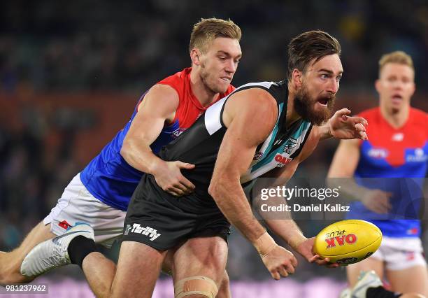 Charlie Dixon of the Power handballs during the round 14 AFL match between the Port Adelaide Power and the Melbourne Demons at Adelaide Oval on June...