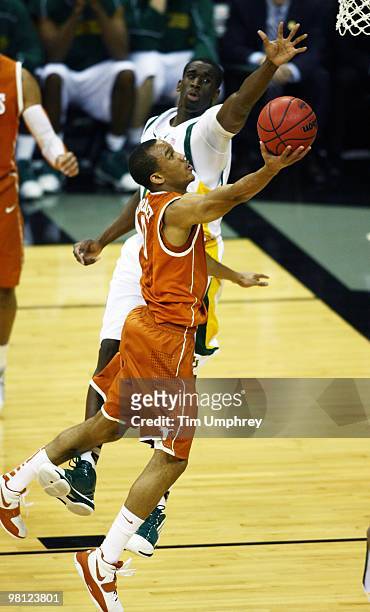 Avery Bradley of the Texas Longhorns goes up for a layup while defended by Ekpe Udoh of the Baylor Bears during the quarterfinals of the 2010...