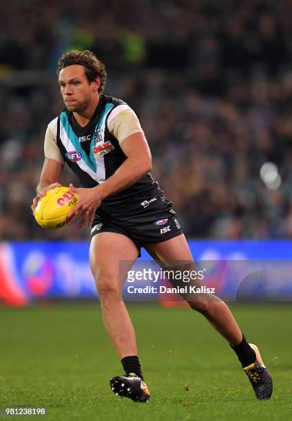 Steven Motlop of the Power runs with the ball during the round 14 AFL match between the Port Adelaide Power and the Melbourne Demons at Adelaide Oval...