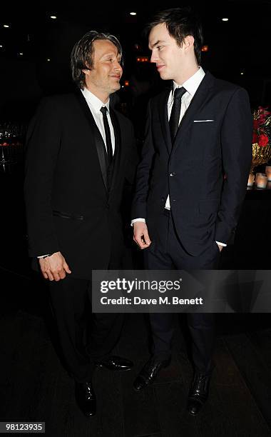 Mads Mikkelsen and Nicholas Hoult attend the afterparty following the World premiere of 'Clash Of The Titans' at Aqua on March 29, 2010 in London,...