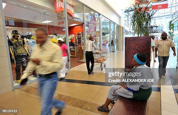 Soweto residents shop at Maponya Mall in Soweto on March 19, 2010 This is the new Soweto, a mix of upper-crust comforts and urban grit, where...