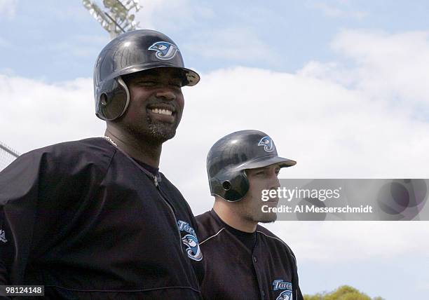 Toronto Blue Jays sluggers Carlos Delgado and Eric Hinske watch batting practice March 3, 2004 in Dunedin, Florida.