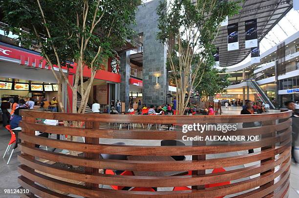 Soweto residents shop at Maponya Mall in Soweto on March 19, 2010 This is the new Soweto, a mix of upper-crust comforts and urban grit, where...