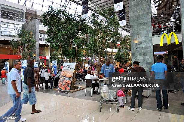 Soweto residents shop at Maponya Mall in Soweto on March 19, 2010 This is the new Soweto, a mix of upper-crust comforts and urban grit, where...