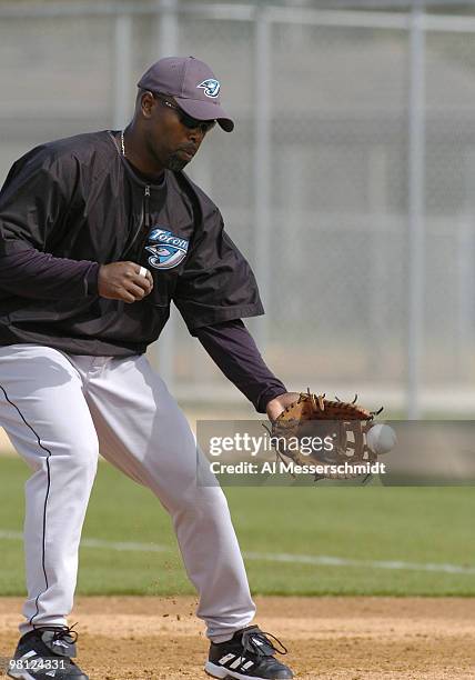 Toronto Blue Jays first baseman Carlos Delgado fields a ball during practice March 3, 2004 in Dunedin, Florida.