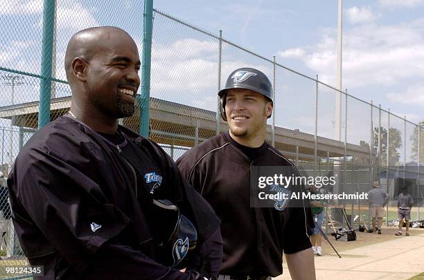 Toronto Blue Jays sluggers Carlos Delgado and Eric Hinske watch practice March 3, 2004 in Dunedin, Florida.