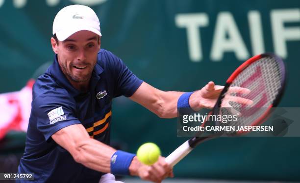 Roberto Bautista Agut from Spain returns the ball to Karen Khachanov from Russia during their match at the ATP Gerry Weber Open tennis tournament in...