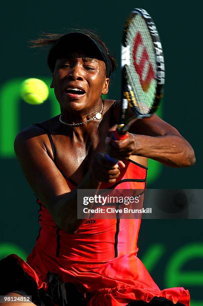 Venus Williams of the United States returns a shot against Daniela Hantuchova of Slovakia during day seven of the 2010 Sony Ericsson Open at Crandon...