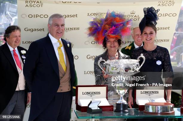 Prince Andrew, Duke of York presents the trophies to owners the Niarchos Family after winning the Coronation Stakes with Alpha Centauri during day...