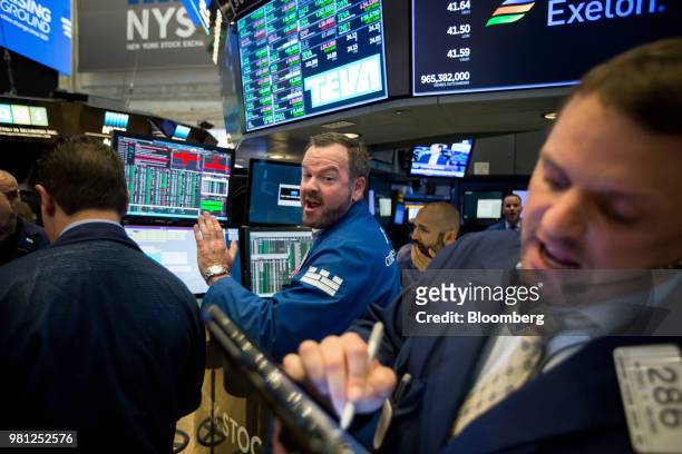 Traders work on the floor of the New York Stock Exchange in New York, U.S., on Friday, June 22, 2018. U.S. Stocks climbed following gains in Europe...