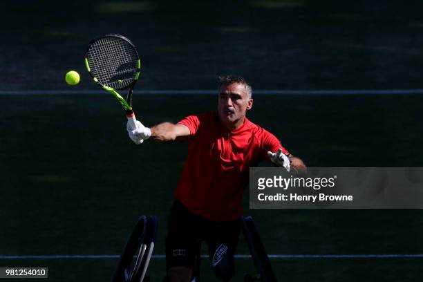 Stephane Houdet of France in action during the men's wheelchair doubles on Day 5 of the Fever-Tree Championships at Queens Club on June 22, 2018 in...
