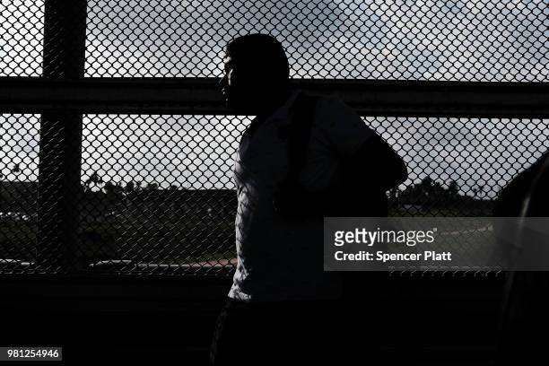 Man waits to make the daily crossing into the American border city of Brownsville, a city which has become dependent on the daily crossing into and...