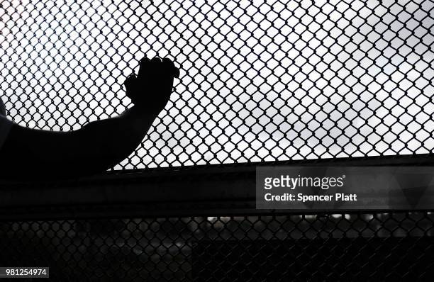 Cuban man seeking asylum waits along the border bridge after being denied into the Texas city of Brownsville which has become dependent on the daily...
