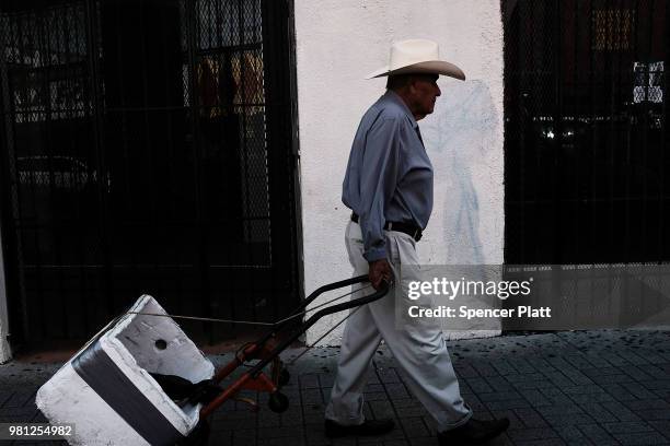 Man walks through downtown Brownsville, a border city which has become dependent on the daily crossing into and out of Mexico on June 22, 2018 in...