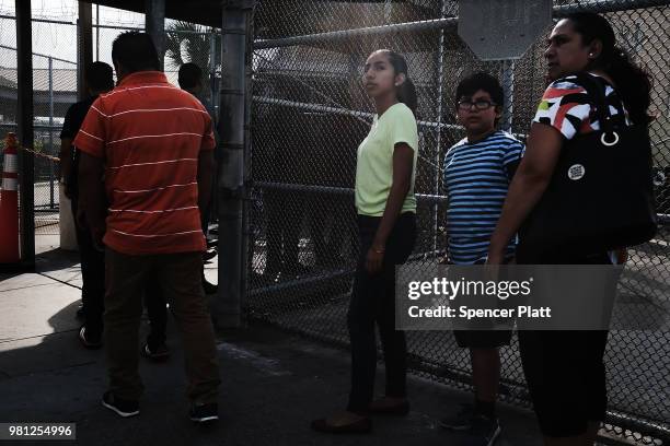 Mexican residents wait to make the daily crossing into the American border city of Brownsville, a city which has become dependent on the daily...