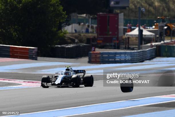 William's Russian driver Sergey Sirotkin drives during the second practice session as the tire of Force India's Mexican driver Sergio Perez's car...