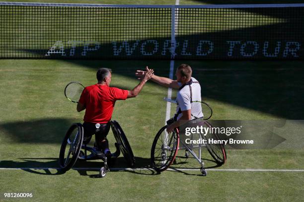 Stephane Houdet and Nicolas Peifer of France celebrate winning the men's wheelchair doubles against Alfie Hewett and Gordon Reid of Great Britain...