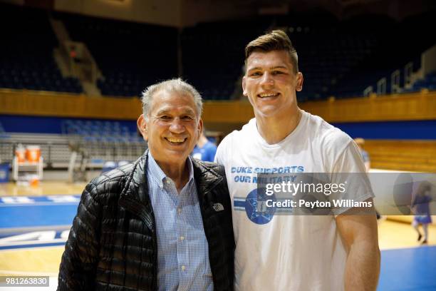 Jacob Kasper of the Duke Blue Devils with WWE talent scout Gerald Brisco on February 17, 2018 during a 19-16 win over Old Dominion at Cameron Indoor...