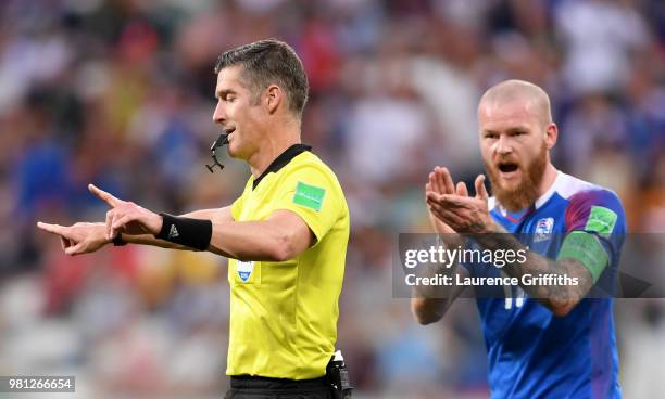 Referee Matthew Conger announces a VAR review during the 2018 FIFA World Cup Russia group D match between Nigeria and Iceland at Volgograd Arena on...