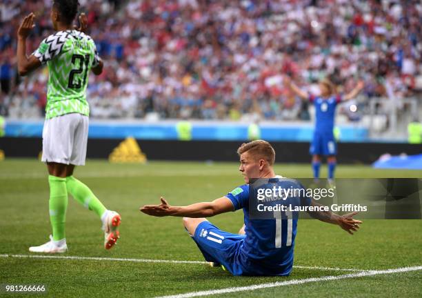 Alfred Finnbogason of Iceland reacts as he is fouled inside the penalty area, before a penalty is then awarded after a VAR review during the 2018...