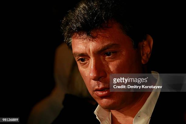 Russian opposition politician Boris Nemtsov looks on in memory of the victims of a blast inside the Lubyanka metro station on March 29, 2010 in...