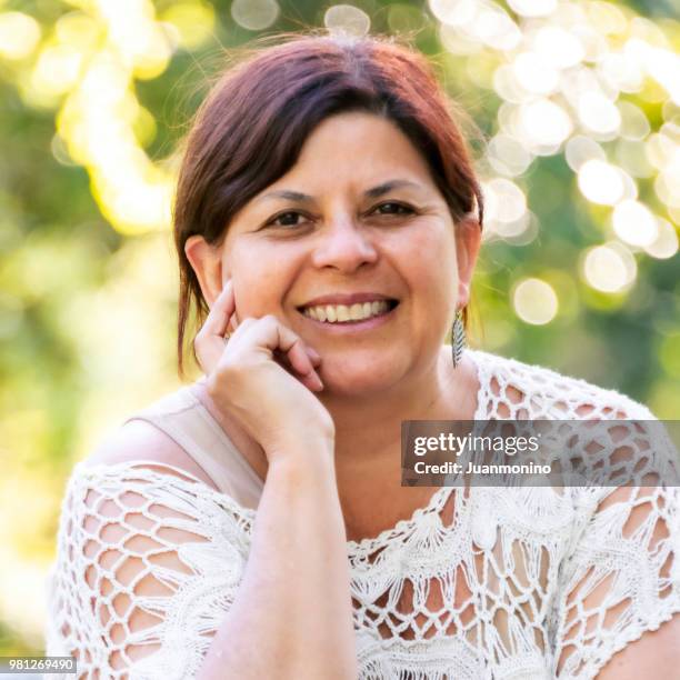 smiling mature woman looking at the camera - ecuadorian ethnicity stock pictures, royalty-free photos & images