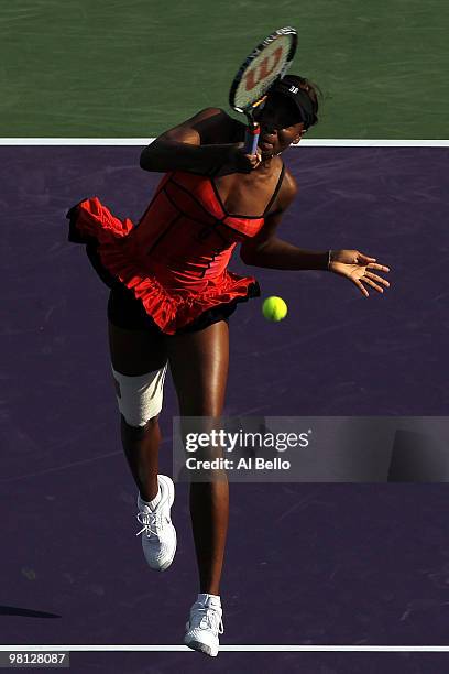 Venus Williams of the United States returns a shot against Daniela Hantuchova of Slovakia during day seven of the 2010 Sony Ericsson Open at Crandon...
