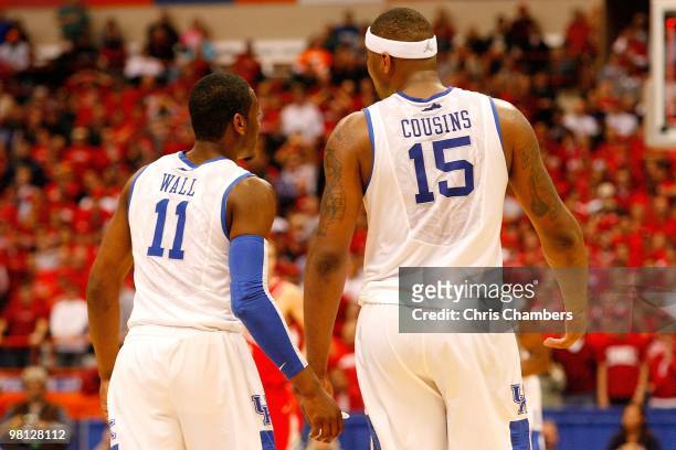 John Wall and CeMarcus Cousins of the Kentucky Wildcats talk on court against the Cornell Big Red during the east regional semifinal of the 2010 NCAA...