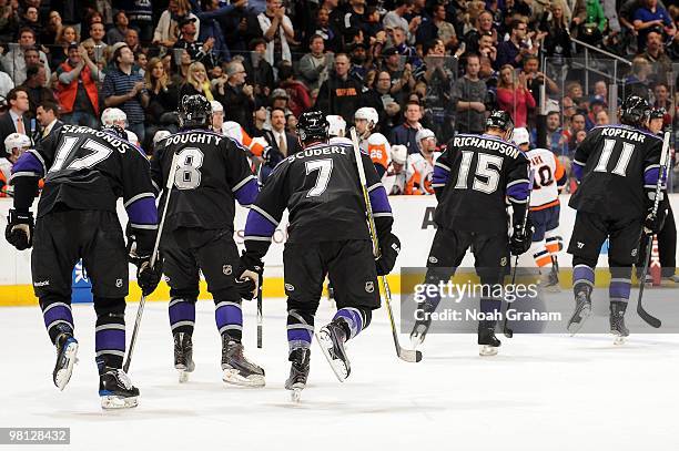 Wayne Simmonds, Drew Doughty, Rob Scuderi, Brad Richardson, and Anze Kopitar of the Los Angeles Kings skate to the bench during a game against the...