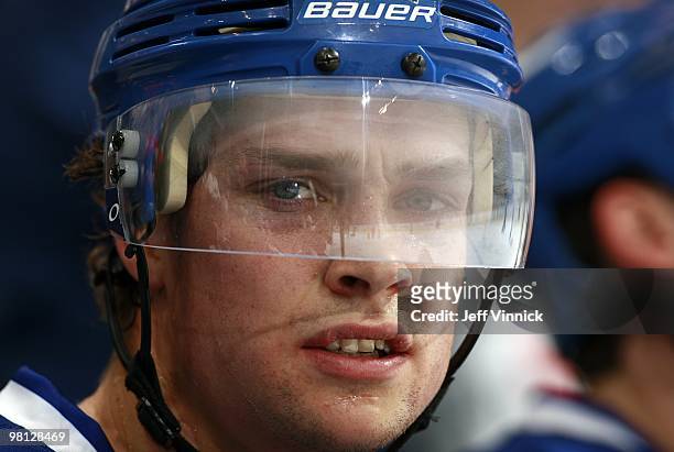 Mason Raymond of the Vancouver Canucks looks on from the bench through a fogged shield during their game against the Calgary Flames at General Motors...