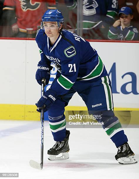 Mason Raymond of the Vancouver Canucks skates up ice with the puck during their game against the Calgary Flames at General Motors Place on March 14,...