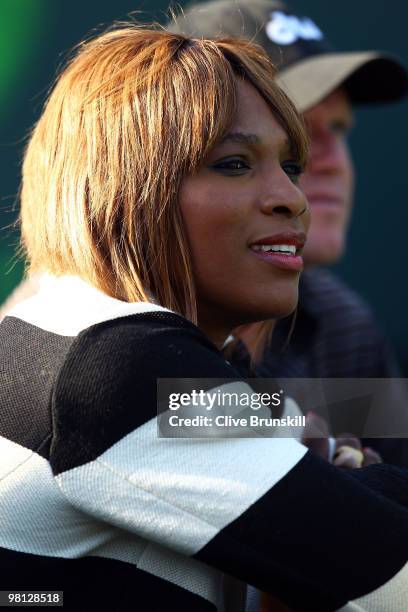 Serena Williams watches as her sister Venus Williams of the United States plays against Daniela Hantuchova of Slovakia during day seven of the 2010...