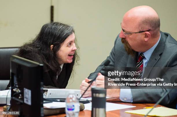 Louise Turpin, left, talks to her attorney Jeff Moore as she appears in Superior Court in Riverside County, Calif. On Wednesday, June 20, 2018 for a...