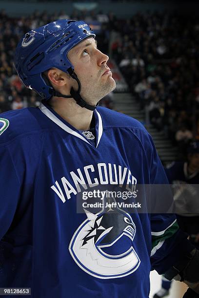 Andrew Alberts of the Vancouver Canucks looks on from the bench during their game against the Calgary Flames at General Motors Place on March 14,...