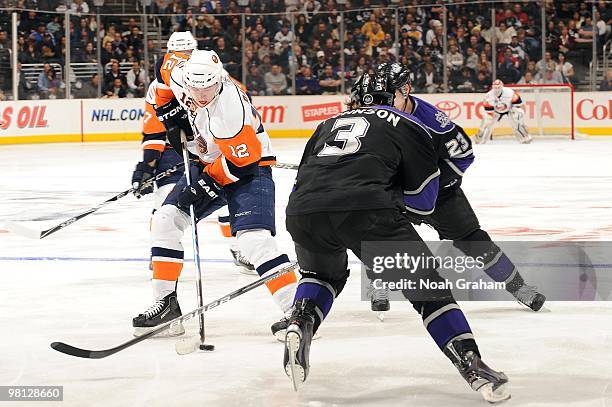 Josh Bailey of the New York Islanders skates against Jack Johnson and Dustin Brown of the Los Angeles Kings at Staples Center on March 20, 2010 in...