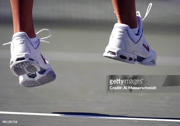 Vera Douchevina leaps into a serve and loses to Jennifer Capriati in the third round of the women's singles September 3, 2004 at the 2004 US Open in...